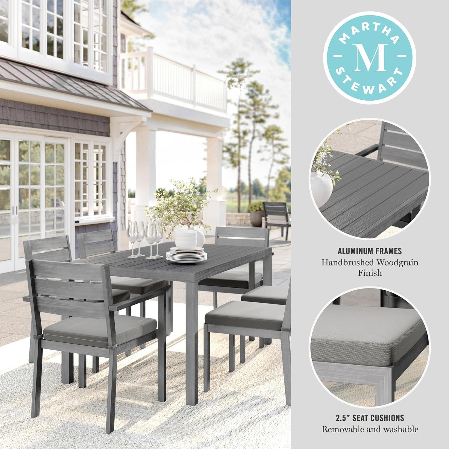 imageMartha Stewart Bedford 7 Piece Aluminum Patio Set with 62quot Table and 6 Stackable Chairs with Gray Brushed Woodgrain Finish Gray AllWeather Seat CushionsGrey