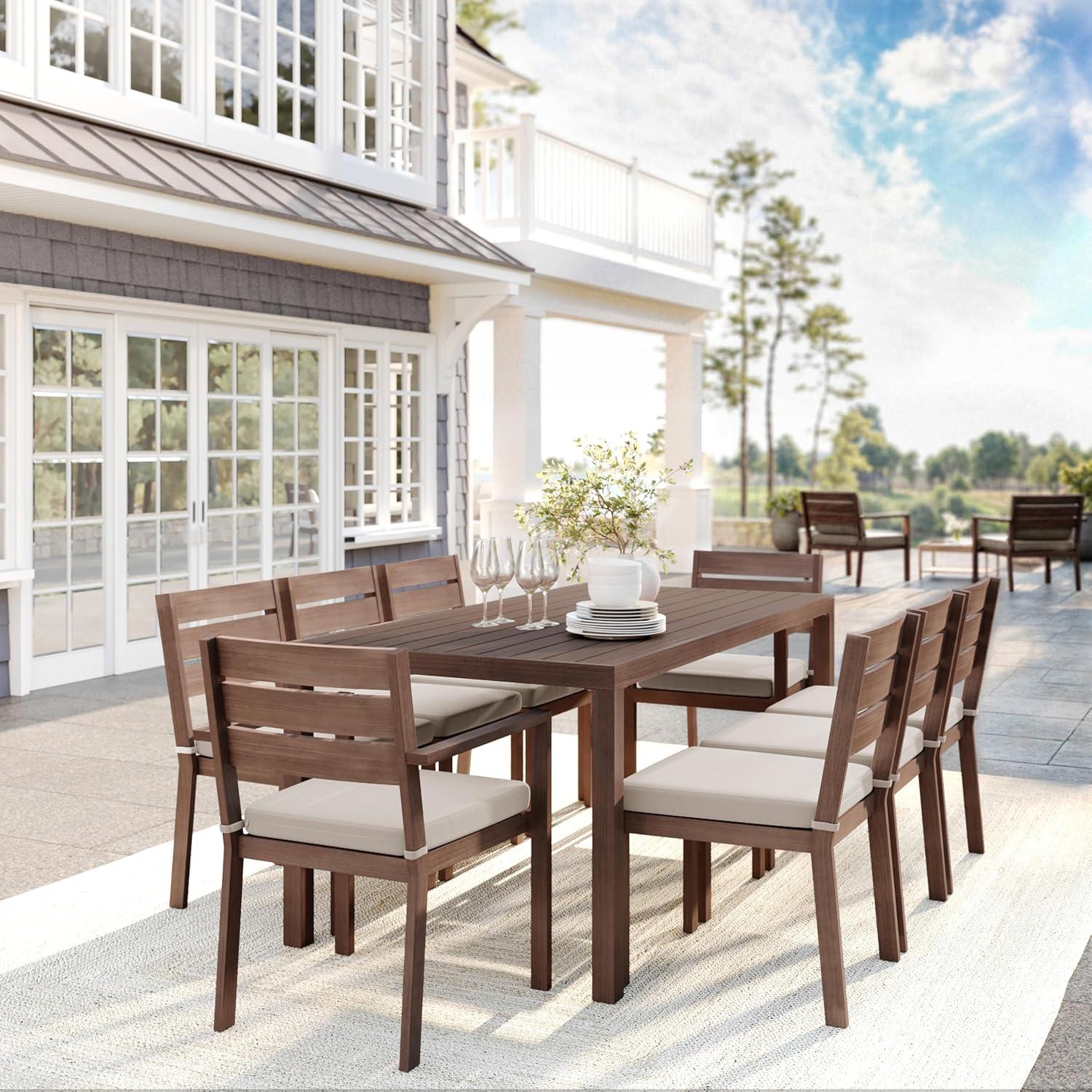 imageMartha Stewart Bedford 9 Piece Patio Set with 71quot Table and 8 Stackable Chairs with Brown Brushed Woodgrain Aluminum Finish Cream AllWeather Seat Cushions