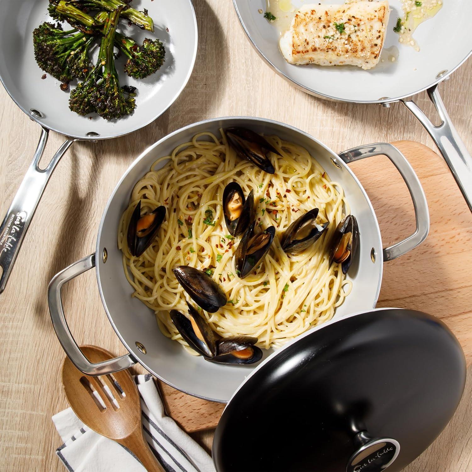 imageSur La Table Kitchen Essentials Potluck Porch 10 Piece PFA Free Ceramic Non stick Interior Forged Aluminum Cookware Pots and Pans Set WAluminum Lids Black Induction CompatibleBlack